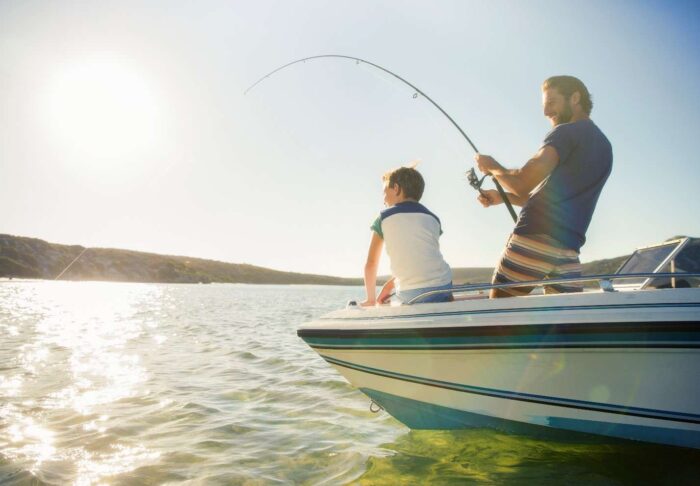 A Father is Teaching his Son a Fishing Activity at San Pedro Bay in California