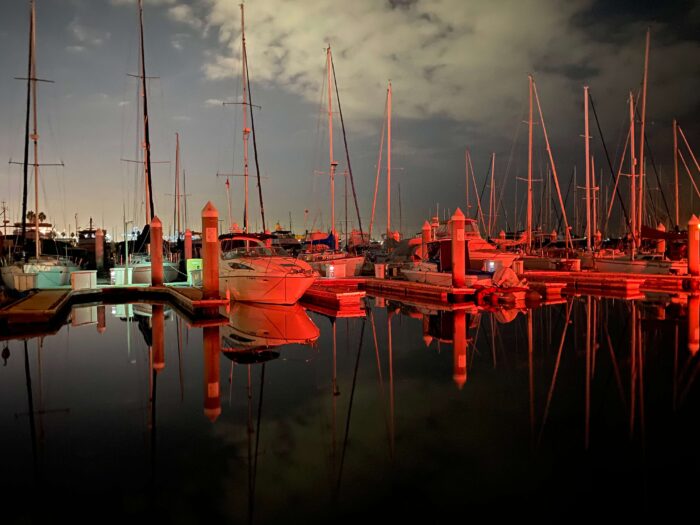 A White Sailboat parked at the Cabrillo Marina Dockyard for Boat Rental Services in California